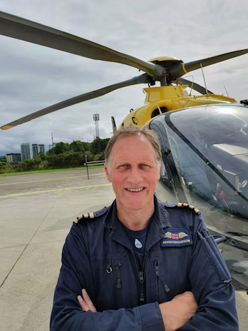 Sir Adam Fergusson with Helicopter